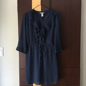 Navy dress with tie.